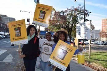 Freshman Aaliyah Meade and her peers were stationed on Georgia Avenue with their donation buckets. They chose to wait by the #70 bus stop in hopes of catching people coming on and off the bus. (Diandra Bolton/Howard University News Service)