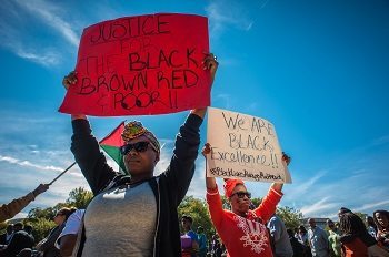 WASHINGTON, DC -- 10/10/15 -- Jessica Graves, left, and Annie Cleopatra, of New York City, came because the revolutionary message resonated with them. "We're tired of seeing the same results," said Graves. Justice or Else is the theme for the 20th Anniversary Million Man March at the National Mall. Minister Louis Farrakhan and the Nation of Islam drew hundreds of thousands to the nation's capital to draw attention to police brutality, oppression, and deliver a message of unity between African-Americans, Native-Americans and Latinosby André Chung #_AC17457