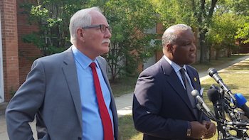 Prince George's County Executive Rushern L. Baker III (right) and public schools CEO Kevin Maxwell speak to reporters outside Glassmanor Elementary in Oxon Hill on Aug. 29, the first day of school for the county's Head Start program. Photo by William J. Ford
