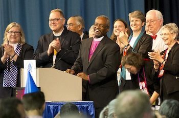 Presiding Bishop-elect Michael Curry, bishop of the Diocese of North Carolina, speaks at the House of Deputies hall in Salt Lake City after deputies confirmed his election as the 27th presiding bishop of the Episcopal Church on June 27. (Cynthia L. Black/Episcopal News Service)