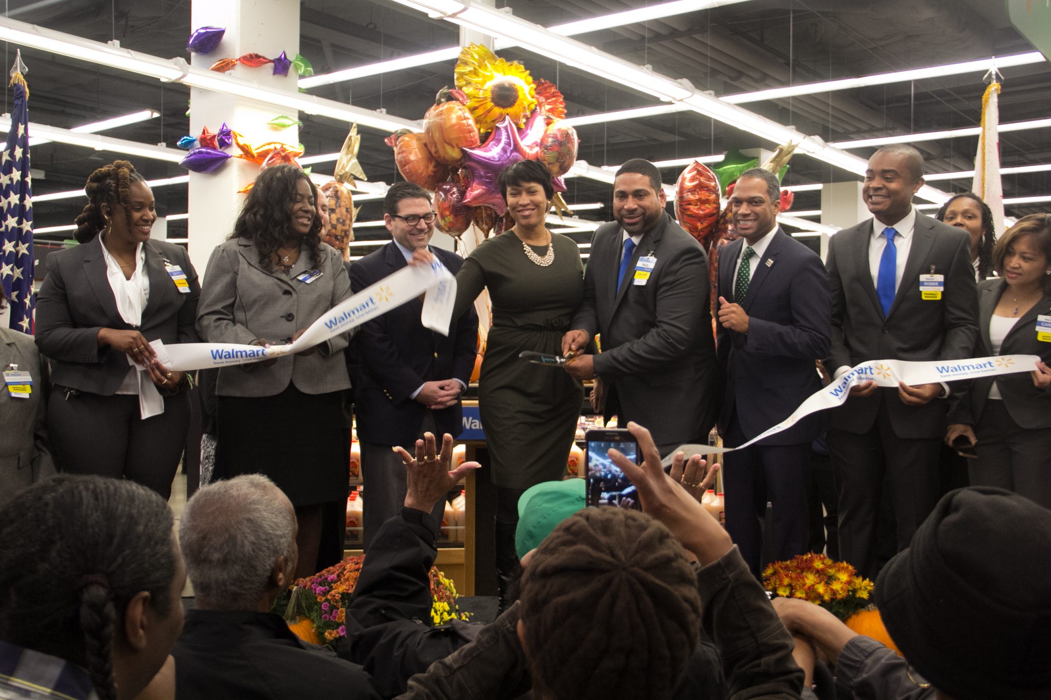 D.C. Mayor Muriel Bowser (center) participated in the ribbon-cutting ceremony on Wednesday, Oct. 28, 2015 for the new Walmart store in the Fort Totten community. Photo by Shevry Lassiter