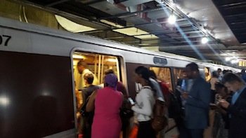 Metrorail passengers board an Orange Line train at the L'Enfant Plaza station in southwest D.C. on June 6. PHOTO BY WILLIAM J. FORD