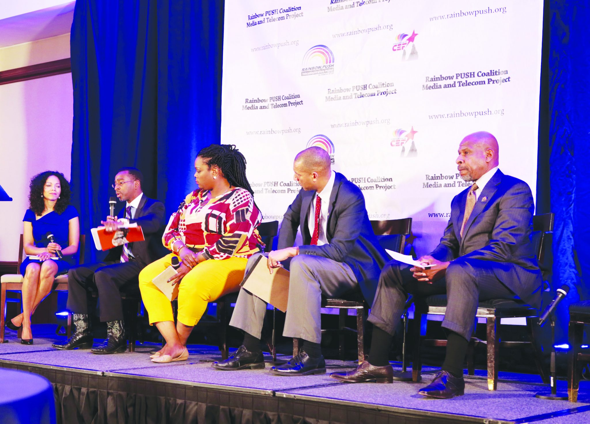Grainger Browning (right) pastor of Ebenezer AME Church in Ft. Washington, Spencer Overton (second from right), president and CEO of the Joint Center for Political and Economic Studies, and Elroy Sailor (second from left), founder and CEO of J.C. Watts Companies, participate in a panel discussion during the annual Media & Telecom Conference at the Capital Hilton Hotel in Northwest on Tuesday, Dec. 6. /Photo by Demetrious Kinney
