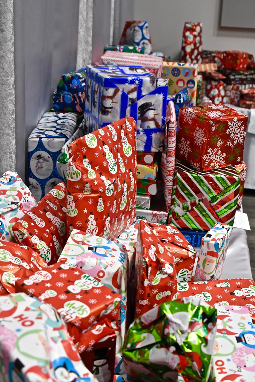 Hundreds of Ward 8 residents participate in the Cozy Christmas at Gateway toy giveaway sponsored by the Events DC and The Washington Informer Charities on Dec. 15. (Travis Riddick)