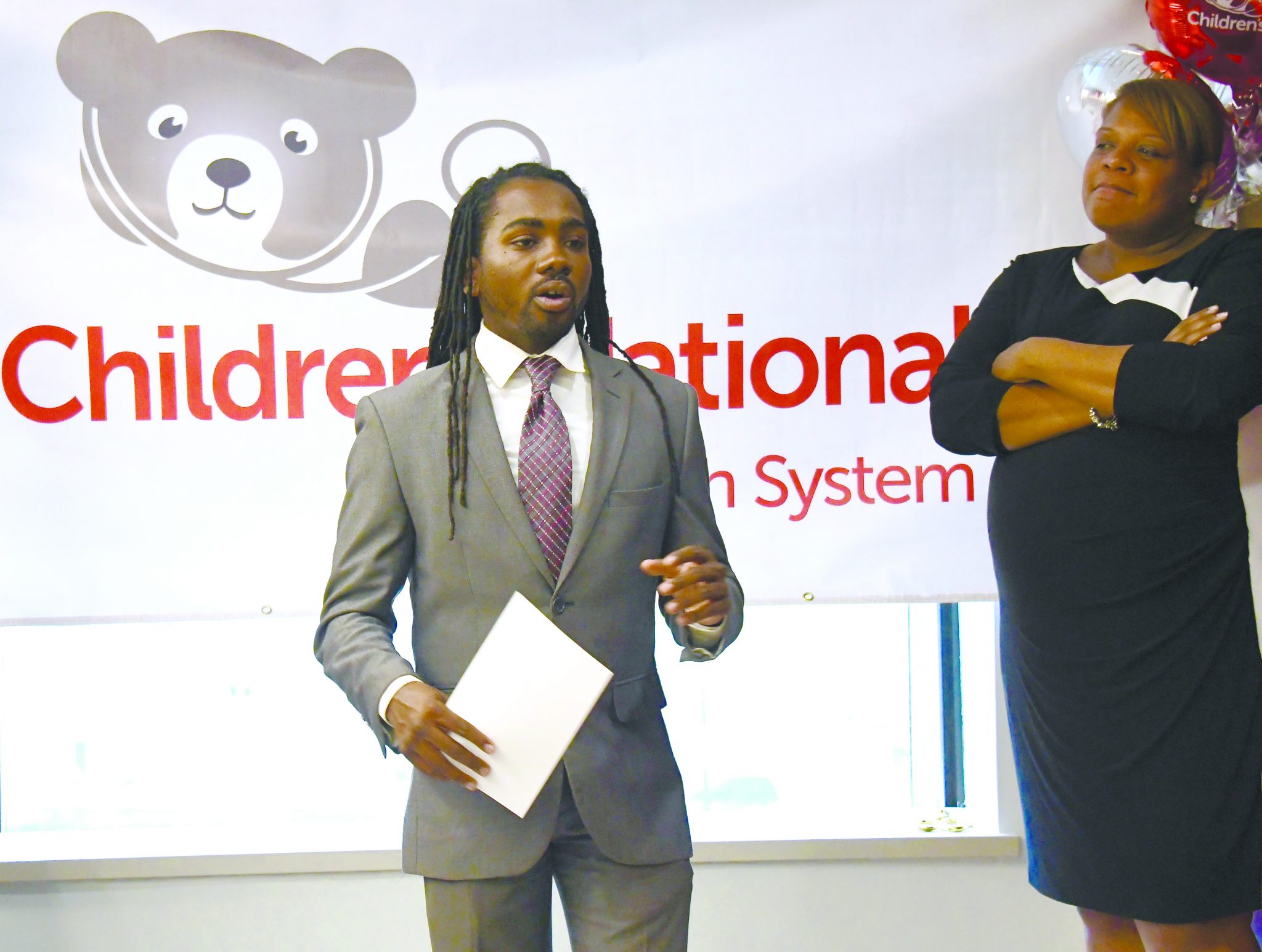 Children's National executives join Ward 8 Councilman-elect Trayon White and Deputy Mayor for Greater Economic Opportunity Courtney Snowden to unveil the new state-of-the-art primary care facility Children's Health Center at Anacostia in Southeast on Nov. 30. /Photo by Travis Riddick