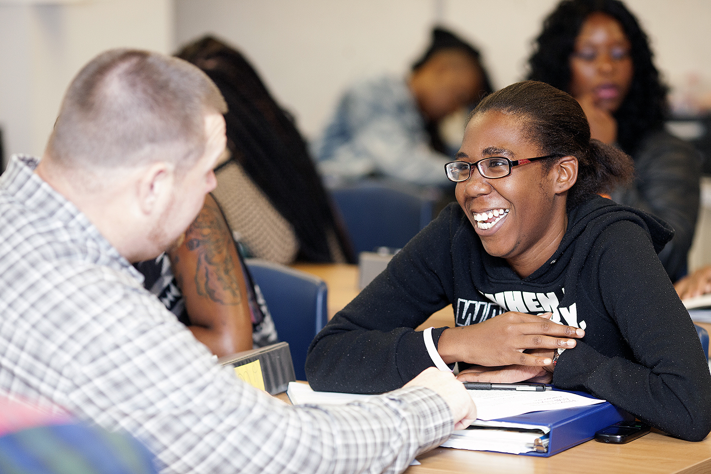 Stephen Johns, YALC social studies teacher, offering one-on-one instruction to a student. /Photo courtesy DC Public Charter School Board © Ann-Marie VanTassell Photography