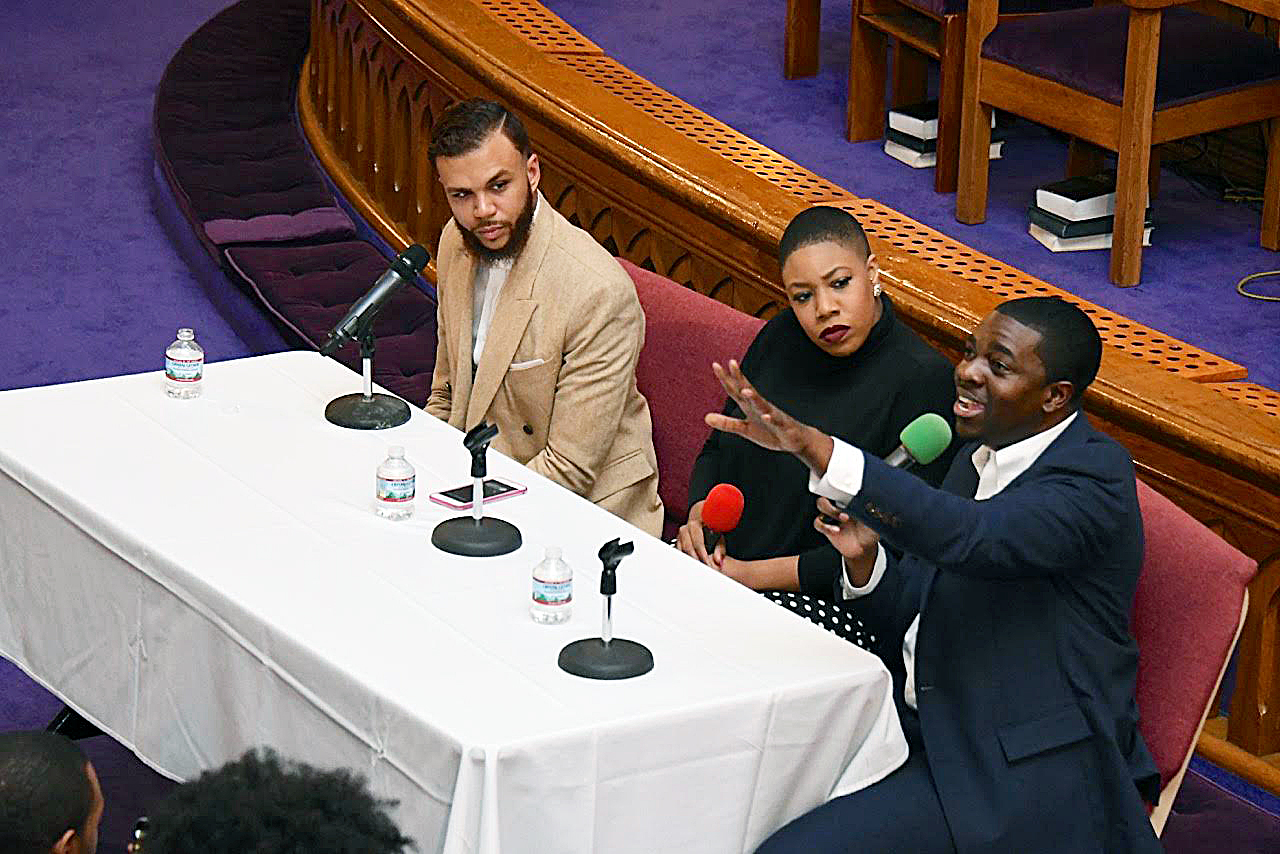 From left: Singer Jidenna, CNN political commentator Symone Sanders and Stephen Green, president of the NAACP's Youth and College Division, attend the "People's Inauguration" rally at Metropolitan AME Church in Northwest on Saturday, Jan. 21. (Travis Riddick/The Washington Informer)