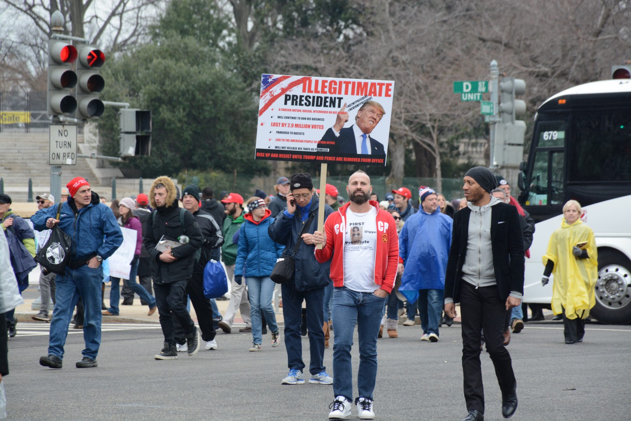 Protesters mixed throughout the crowd leaving the Capitol after the swearing-in of President Donald J. Trump on January 20, 2017. /Photo by Roy Lewis