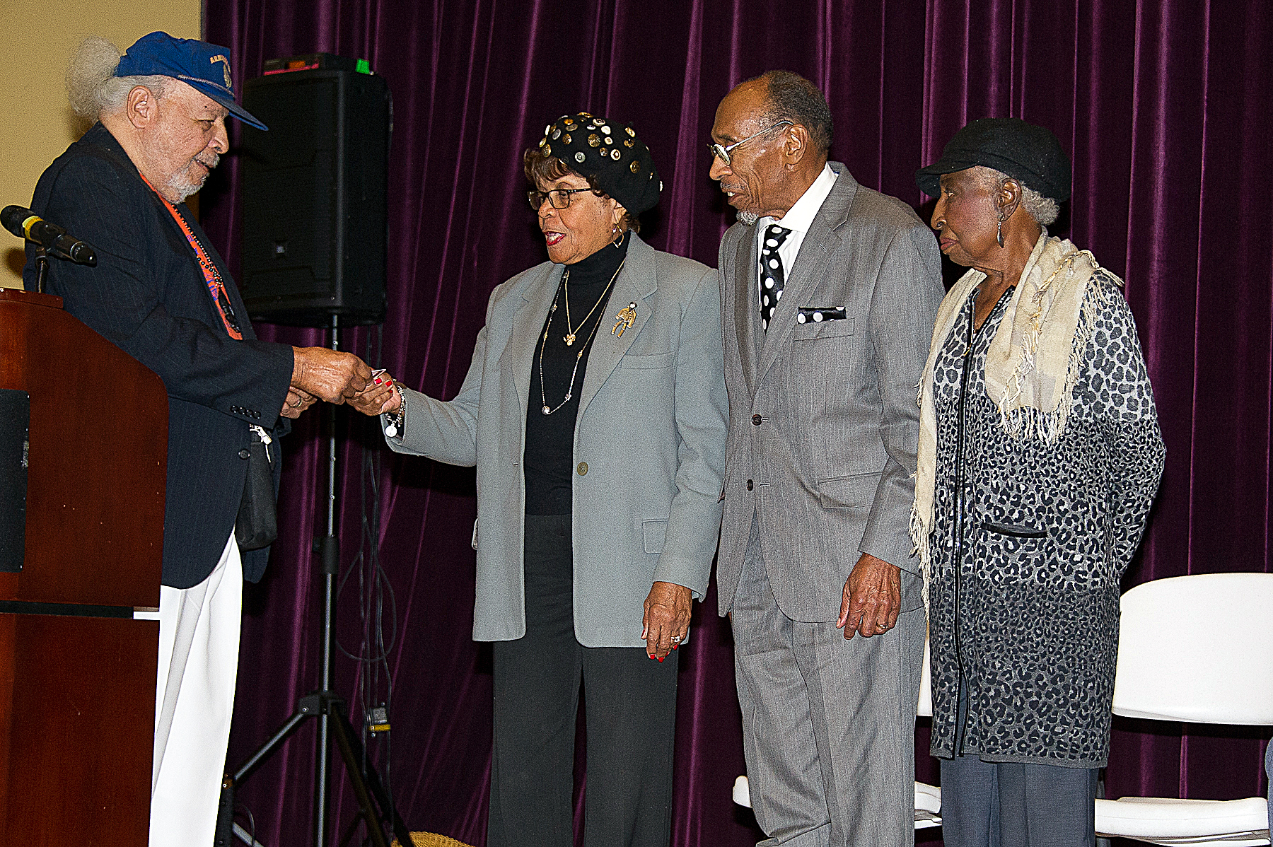 From left: Armstrong Technical School alumnus Jesse Davis (Class of '45) gives special recognition to alumni treasurer Dorothy Brown ('49), alumni President James Nero ('51) and alumni Officer Doris McCannon ('52). /Photo by Lateef Mangum