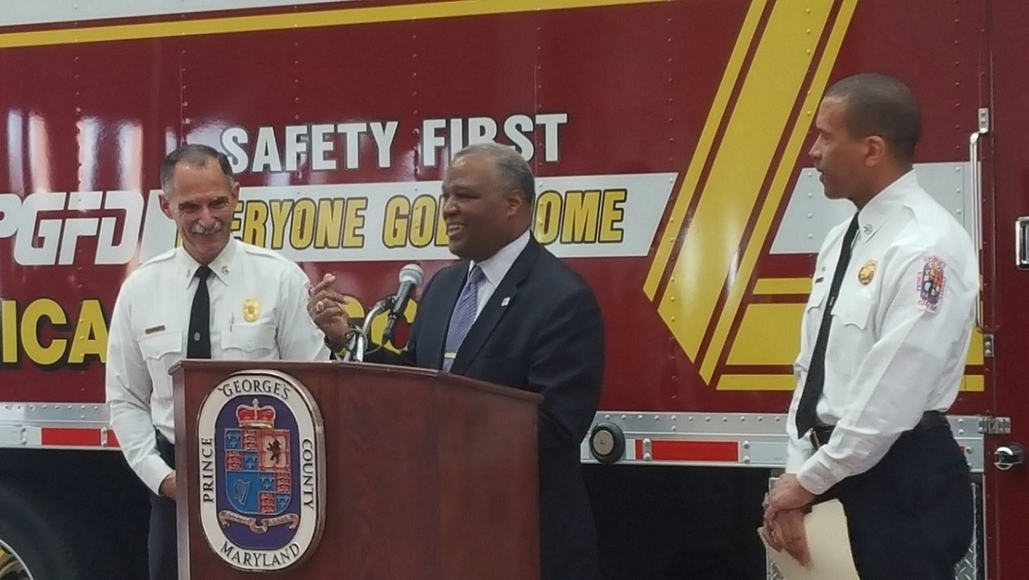Prince George's County Executive Rushern L. Baker III (center) announces the retirement of Fire Chief Marc Bashoor (left) during a news conference at the St. Joseph Fire Station in Springdale on Jan. 6. Deputy Chief Benjamin Barksdale (right), who will serve as interim chief, is Baker's permanent selection for Bashoor's successor. (William J. Ford/The Washington Informer)