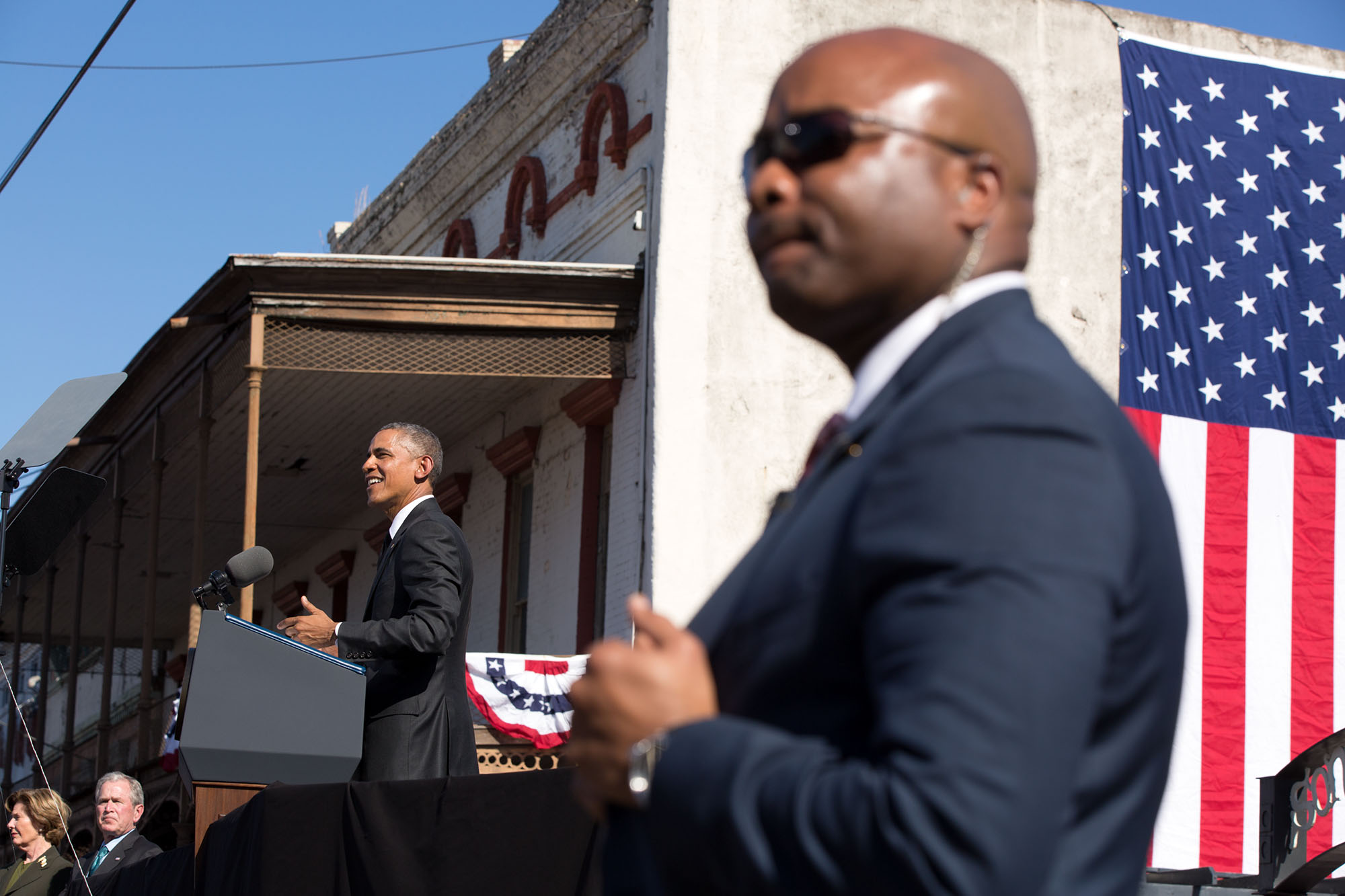**FILE** A Secret Service officer stands post as President Obama speaks. (Pete Souza/The White House)