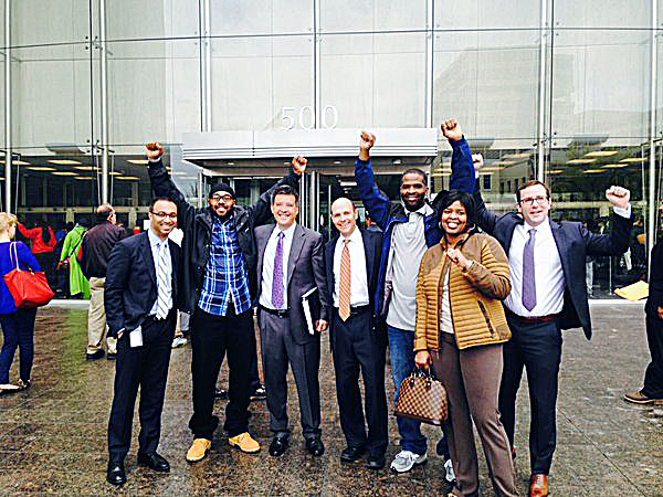 Gary Gathers (second from left) and Keith Mitchell (third from right) celebrate their freedom after murder convictions against them were overturned and the charges dismissed. (Courtesy photo)