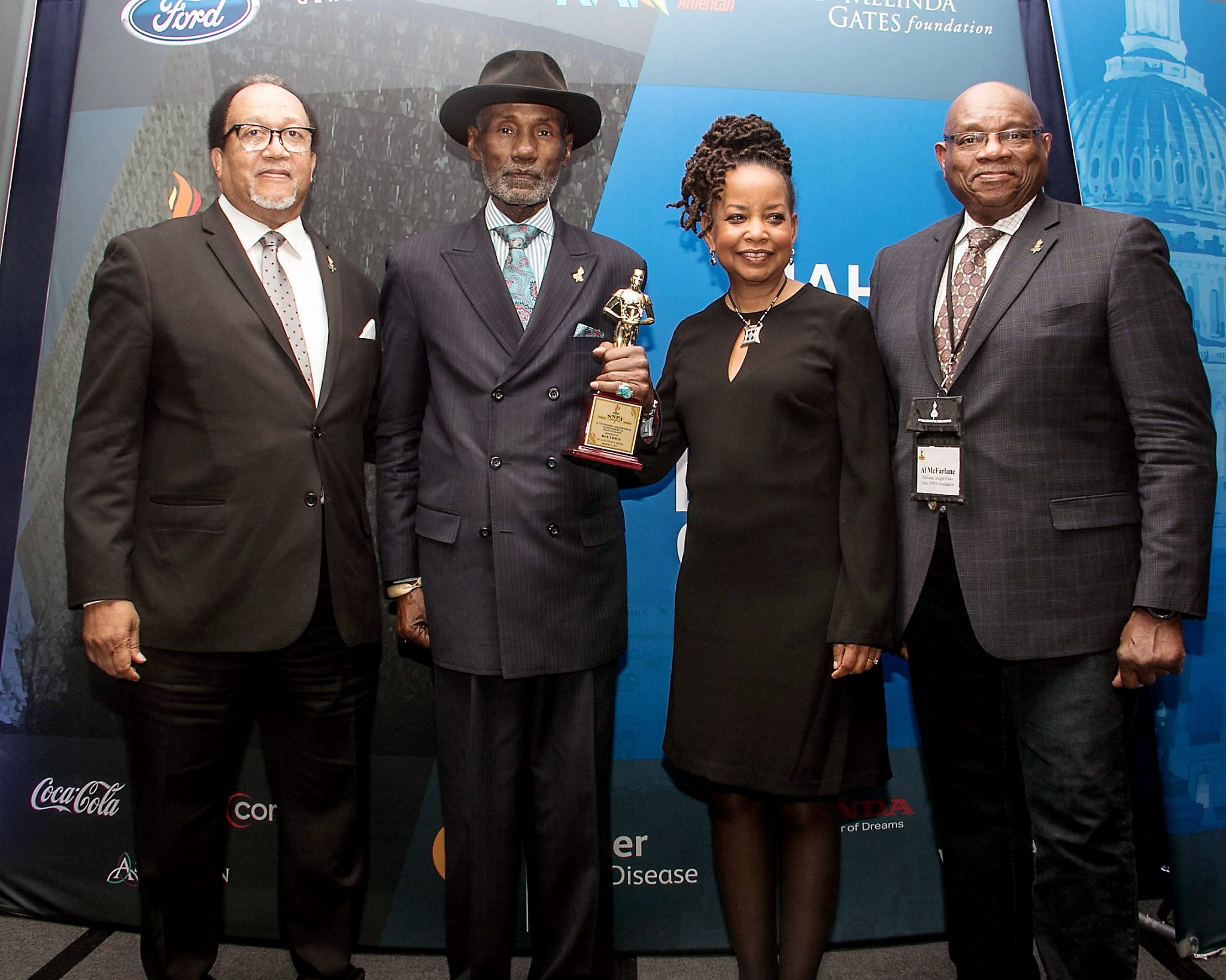Officers for the National Newspaper Publishers Association present Roy Lewis (second from left) with a Torch Award for his outstanding achievement during Black Press Week at the Dupont Circle Hotel in northwest D.C. on March 23. (Shevry Lassiter/The Washington Informer)