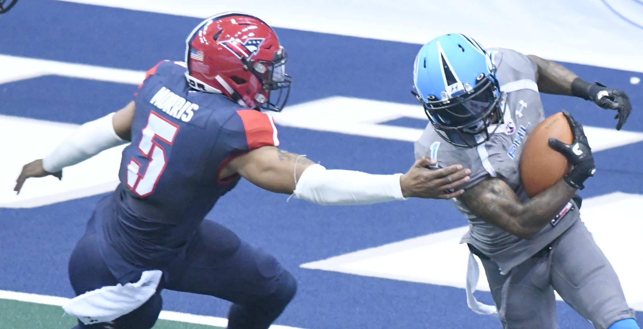 Philadelphia Soul wide receiver Chris Duvalt evades Washington Valor Bernard Morris during Philadelphia's 49-31 win at Verizon Center in Northwest on April 22. (John E. De Freitas/The Washington Informer)