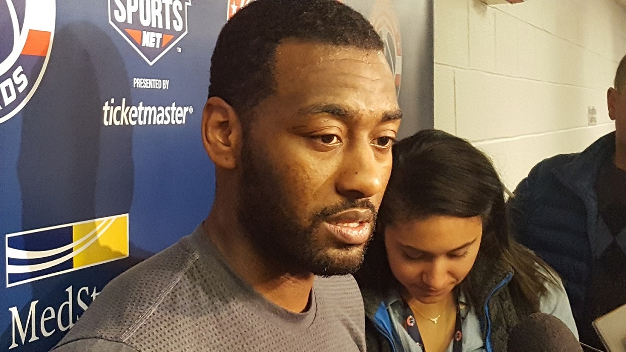 Washington Wizards point guard John Wall speaks with reporters after practice at Verizon Center in D.C. on April 25, a day before the Wizards face the Atlanta Hawks at home in Game 5 of the first-round playoff series. (William J. Ford/The Washington Informer)