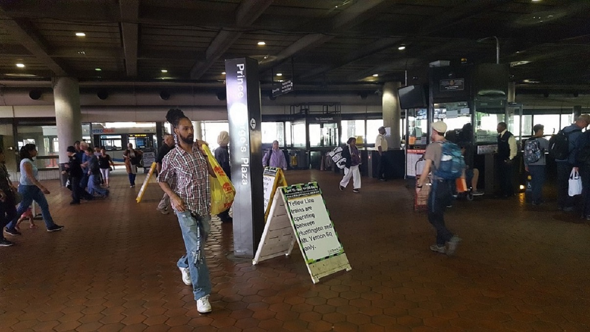 Riders arrive at the Prince George's Plaza Metro station on April 21. (William J. Ford/The Washington Informer)