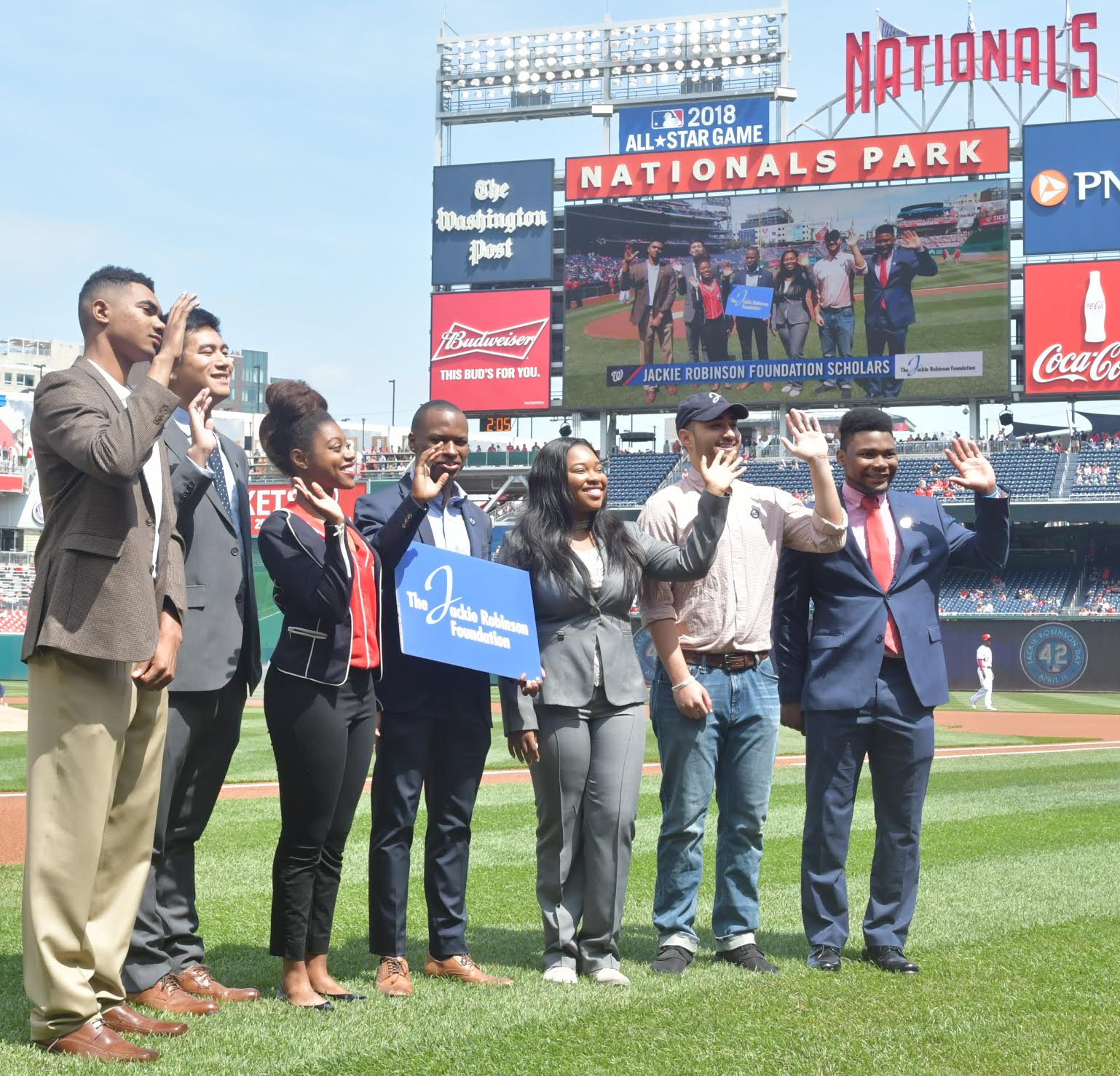 Scholars from the Jackie Robinson Foundation take the field for a pregame ceremony on Jackie Robinson Day at Nationals Park in Southeast on April 15. (John De Freitas/The Washington Informer)
