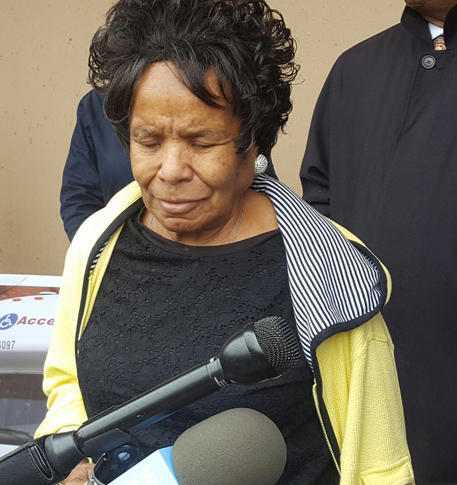 Gloria Swieringa of Fort Washington talks about the need for MetroAccess to provide better service during an April 25 press conference outside Metro headquarters in northwest D.C. (William J. Ford/The Washington Informer)