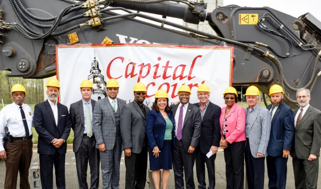Prince George's County Executive Rushern Baker (7th from left) and numerous county dignitaries and well-wishers take part in a groundbreaking ceremony for the Capital Court redevelopment project at the former site of the Metropolitan Baptist Church in Largo. (Courtesy of PGCEDC)