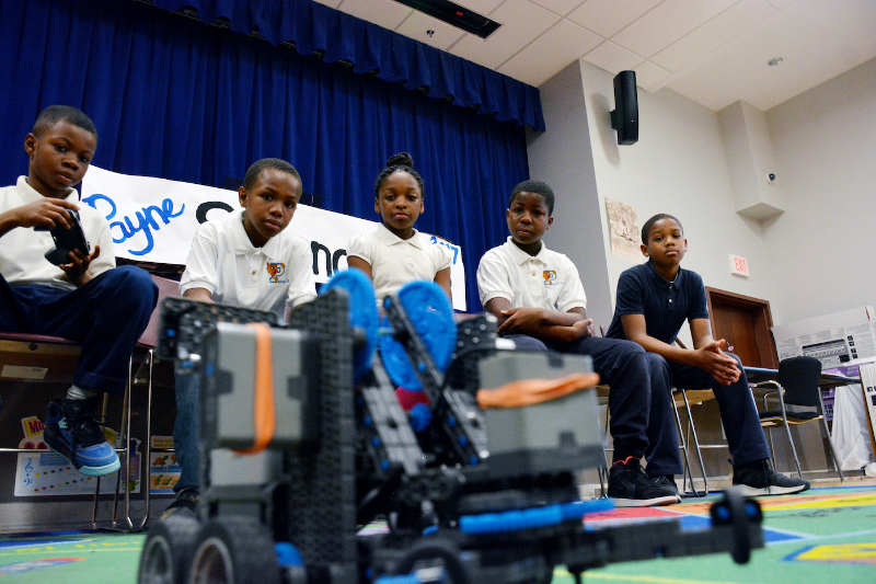 Pepco presents the Payne Elementary School Robotics Club with a $5,000 check on March 30 to pay for their expenses at the 2017 VEX Robotics World Championship in Louisville. (Roy Lewis/The Washington Informer)