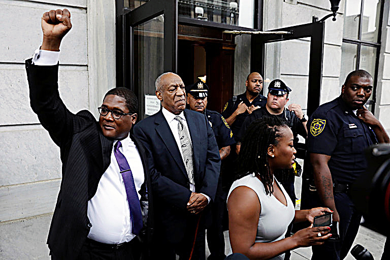 Bill Cosby (center) stands with his spokesman Andrew Wyatt (left) outside of the Montgomery County Courthouse in Norristown, Pennsylvania, on June 17, after the judge in Cosby's sexual assault case declared a mistrial. (Lucas Jackson/Reuters, Pool)