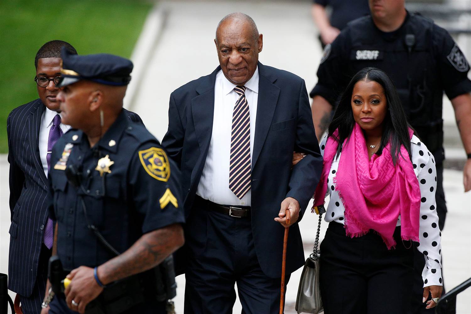 Actor Bill Cosby (center), accompanied by actress Keshia Knight Pulliam (right), arrives at the Montgomery County Courthouse on June 5, 2017, in Norristown, Pennsylvania, for the first day of his sexual assault trial. (Pool photo)