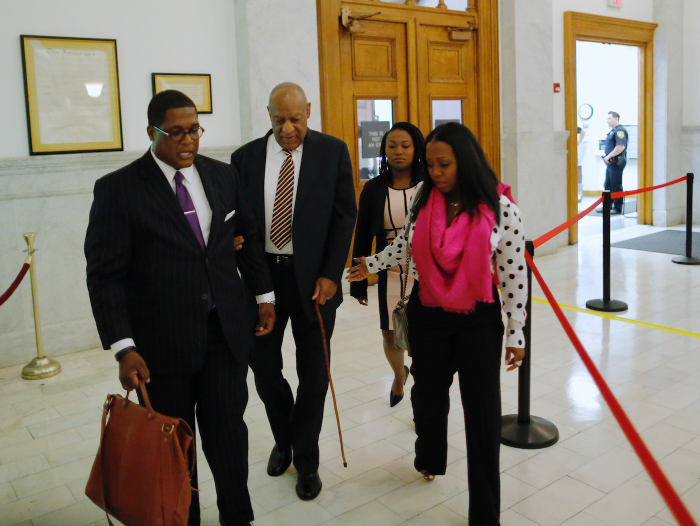 Actor Bill Cosby (second from left), accompanied by actress Keshia Knight Pulliam (right), arrives at the Montgomery County Courthouse on June 5, 2017, in Norristown, Pennsylvania, for the first day of his sexual assault trial. (Pool photo)