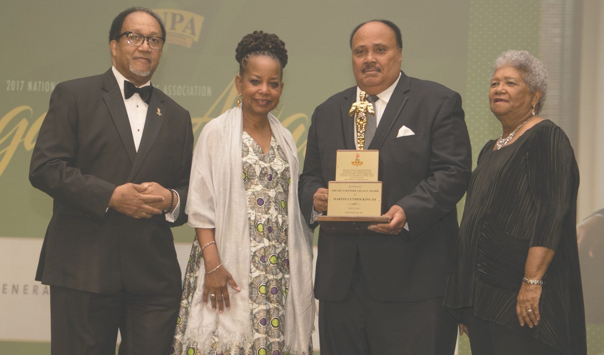 Martin Luther King III (second from right) is presented with the 2017 Lifetime Legacy Award during the National Newspaper Publishers Association's annual convention at the Gaylord National Resort and Convention Center in Oxon Hill, Maryland, on June 22. (Shevry Lassiter/The Washington Informer)