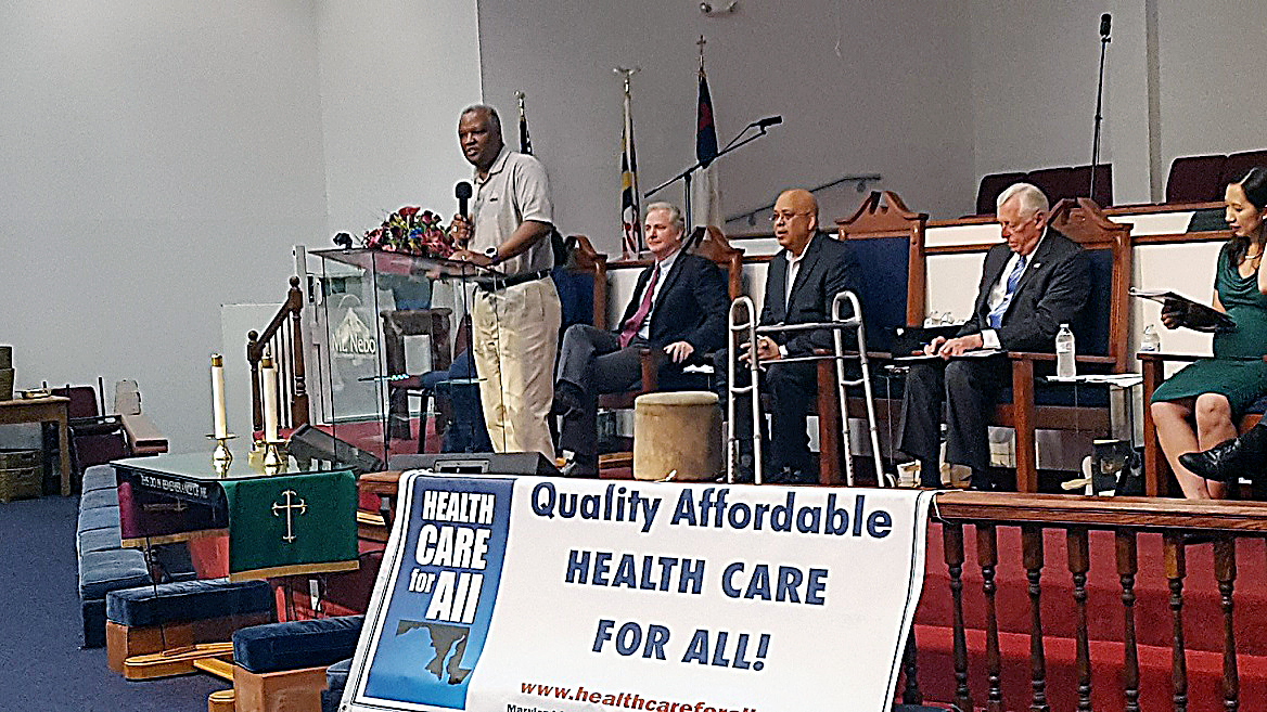 Prince George's County Executive Rushern L. Baker III (standing) speaks during a June 24 health care forum at Greater Mt. Nebo AME Church in Bowie. (William J. Ford/The Washington Informer)