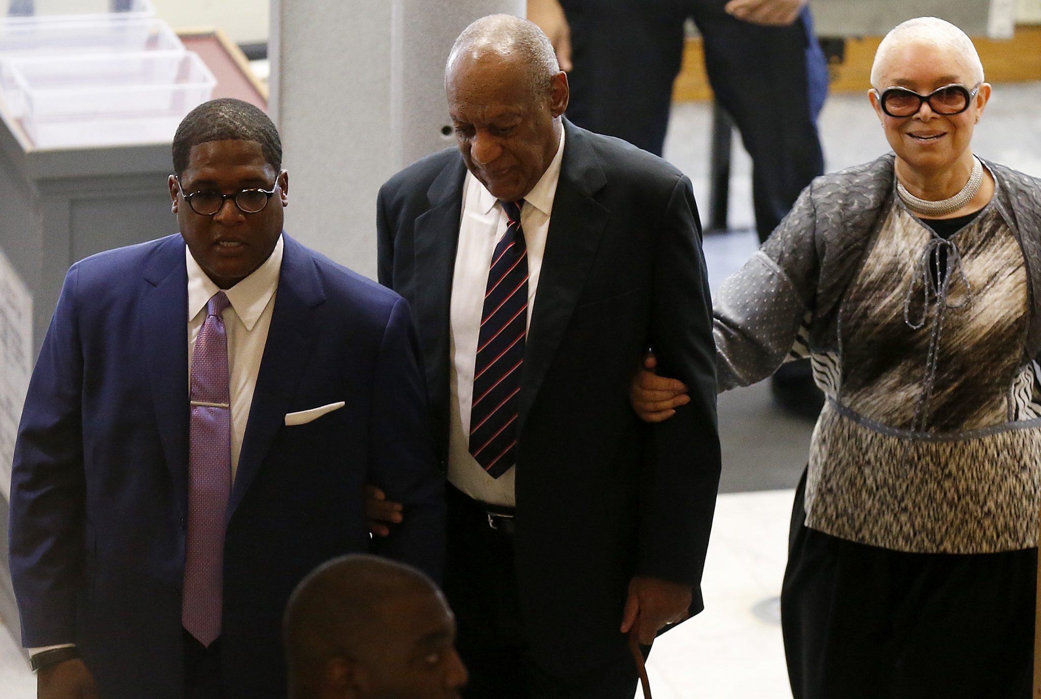 From left: Publicist Andrew Wyatt, Bill Cosby and his wife, Camille Cosby, enter the Montgomery County Courthouse in Norristown, Pennsylvania, on June 12, 2017. Cosby is on trial for sexual assault. (David Maialetti/The Philadelphia Inquirer, Pool)