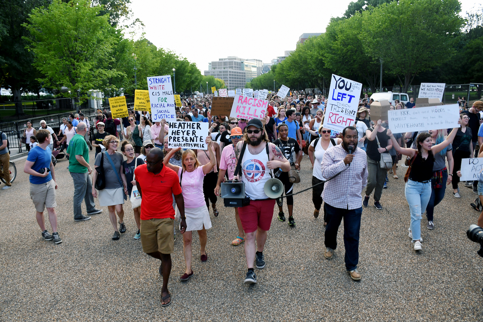 Activist Eugene Puryear (right) leads protesters past Trump Hotel to the confederate statue of Albert Pike near Metropolitan Police Department headquarters after a prayer vigil at Lafayette Park in northwest D.C. on Aug. 13. (Roy Lewis/The Washington Informer)