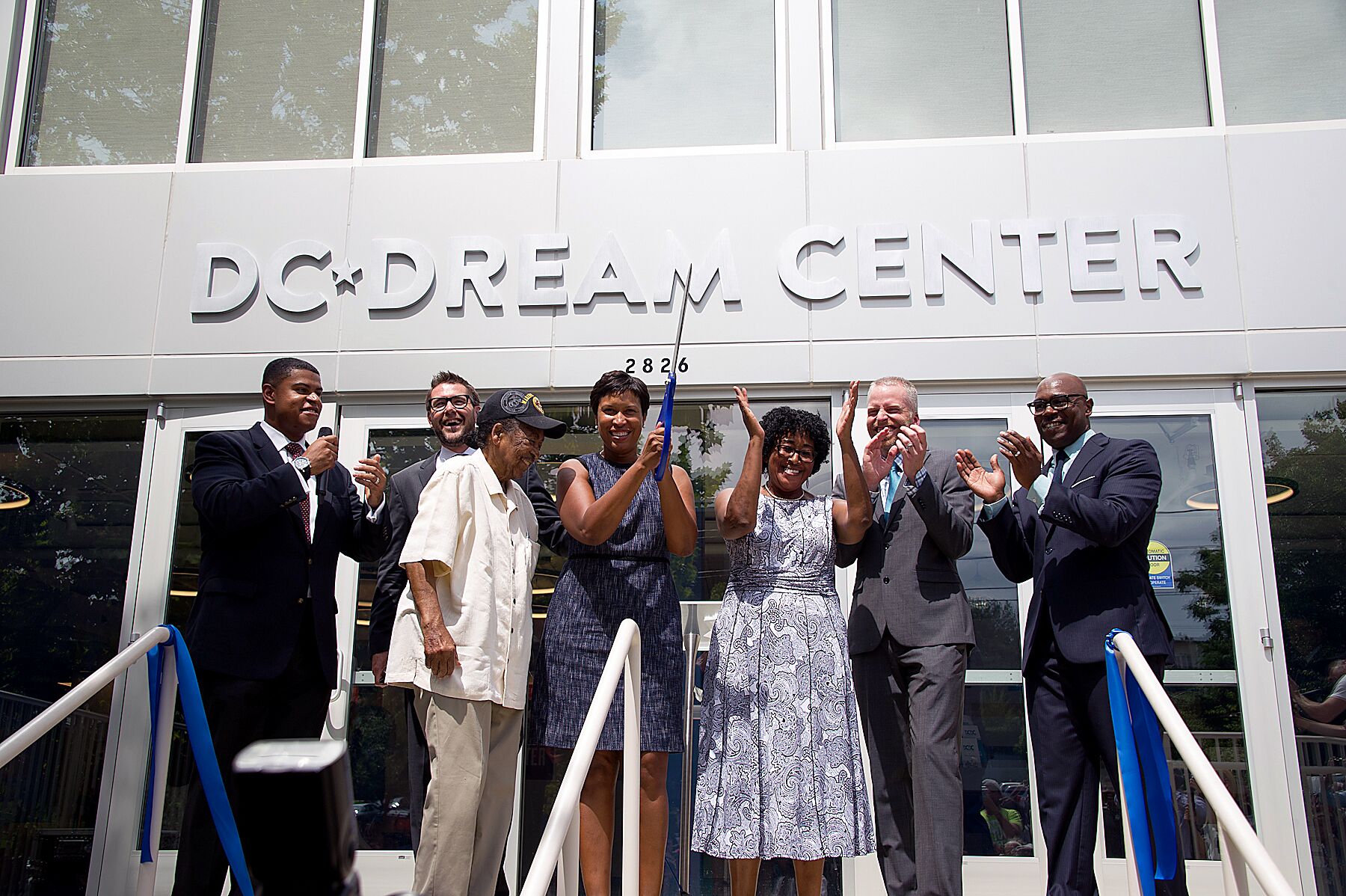 Mayor Muriel Bowser and D.C. Dream Center officials cut the ribbon and open the doors for the newly renovated facility in southeast D.C. on Aug. 23. (Lateef Mangum/The Washington Informer)