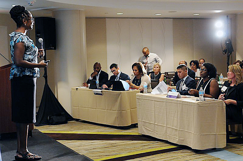 Dr. Charlene Brown, CEO of ReciproCare, addresses an audience at a D.C. event. (Courtesy photo)