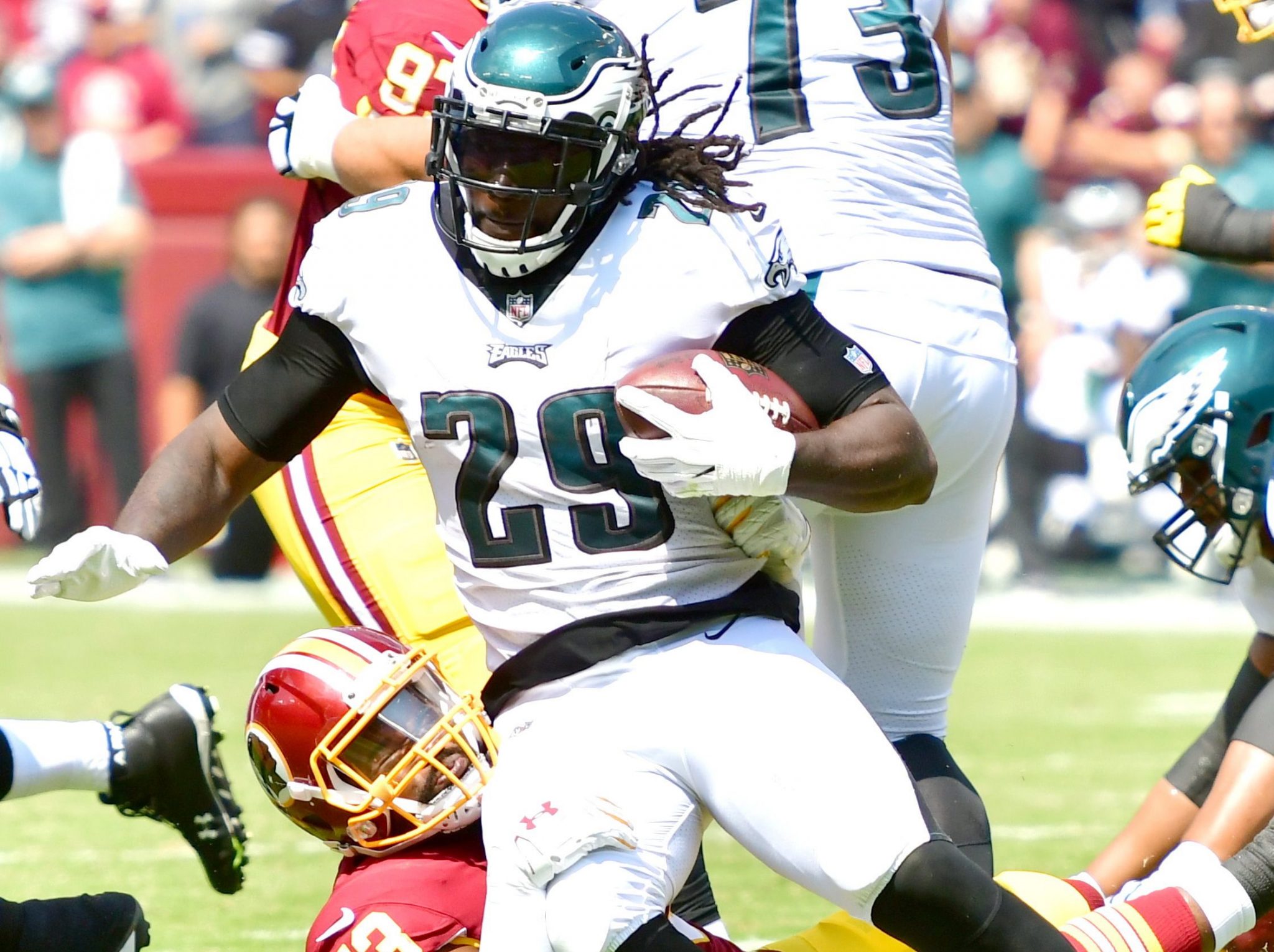 Philadelphia Eagles running back LeGarrette Blount is tackled by Washington Redskins linebacker Zach Brown during the Eagles' 30-17 win at FedEx Field in Landover, Md., on Sept. 10. (John E. De Freitas/The Washington Informer)