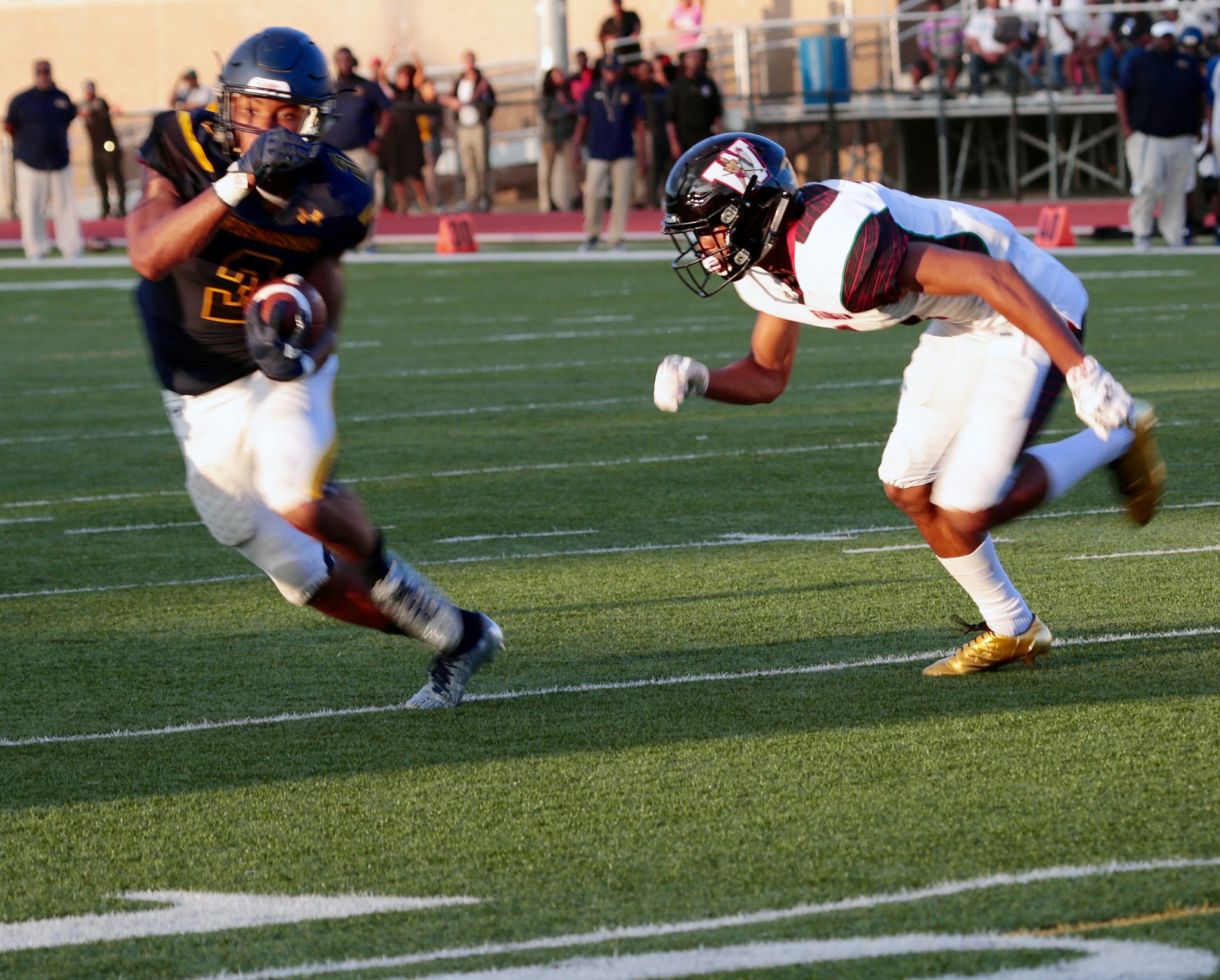 Friendship Collegiate Academy's J. Crute (3) tries to elude an H.D. Woodson defender during the Sept. 15 "Ward 7 Clash of the Titans" game at Woodson's Northeast campus. Friendship Collegiate Academy won 25-19. (Demetrious Kinney/The Washington Informer)