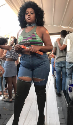 A model sports the Kente collection from the Athleisure line Glamourina during a Sept. 4 fashion show at Decades Nightclub in northwest D.C. (Jade James-Gist/The Washington Informer)
