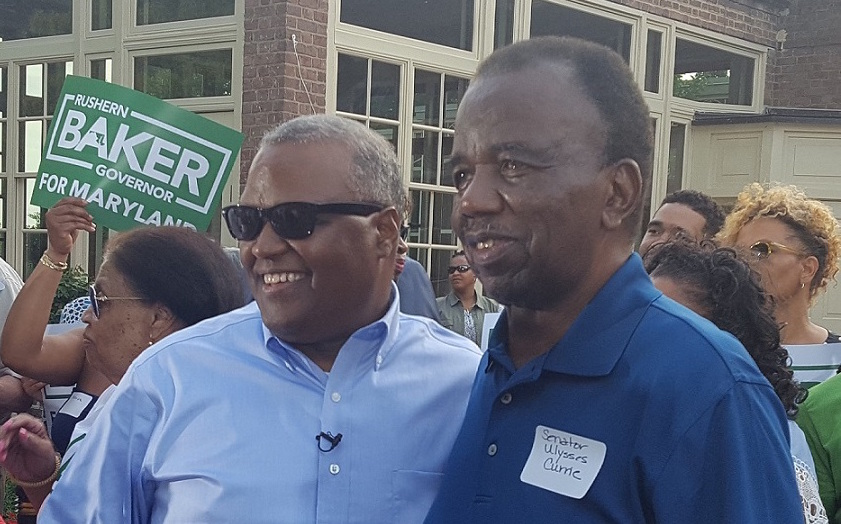 **FILE** Prince George's County Executive Rushern L. Baker III (left), standing with state Sen. Ulysses Currie, declares his candidacy for Maryland governor at a June 29 barbecue in Mitchellville. (William J. Ford/The Washington Informer)