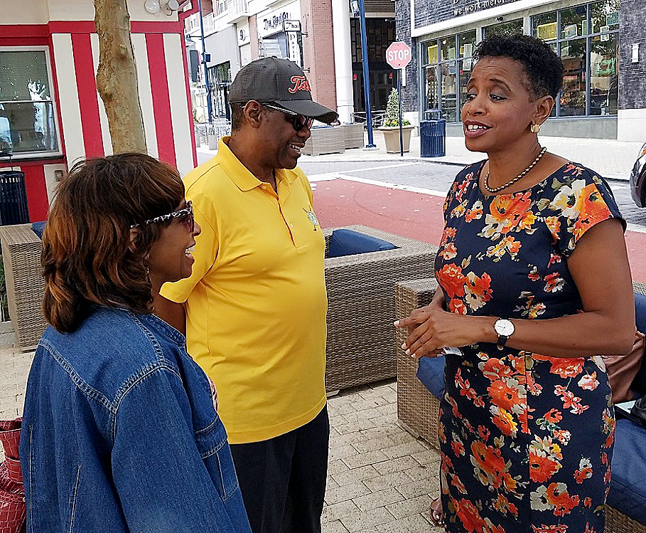Donna Edwards (right) chats with Vann and Diane Jones of Upper Marlboro at Maryland's National Harbor on Oct. 5 after announcing earlier in the day that she will run for county executive. (William J. Ford/The Washington Informer)