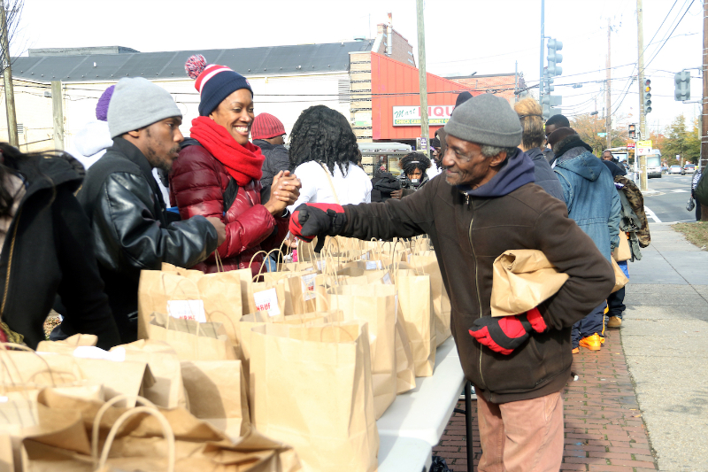 Residents participate in "Community Clean Up Day" in Ward 8 on Nov. 10. (Shevry Lassiter/The Washington Informer)