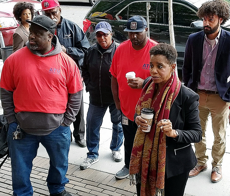 Former Maryland Rep. Donna Edwards (right) chats with members of the Amalgamated Transit Union Local 689 and other union representatives outside Metro headquarters in northwest D.C. on Oct. 26. Edwards, who's running for Prince George's County executive, came out to support the Metro workers' push for additional safety measures within the transit system. (William J. Ford/The Washington Informer)