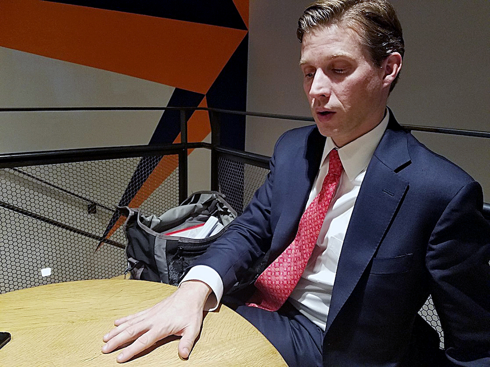 Maryland gubernatorial candidate Alec Ross talks about his campaign at Compass Coffee in northwest D.C. on Dec. 13. (William J. Ford/The Washington Informer)
