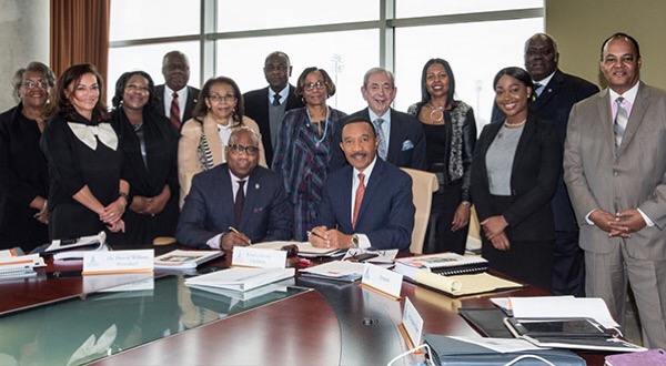 Morgan State University announces a contract extension for President David Wilson (seated, left) on Feb. 7. (Courtesy of Morgan State University)
