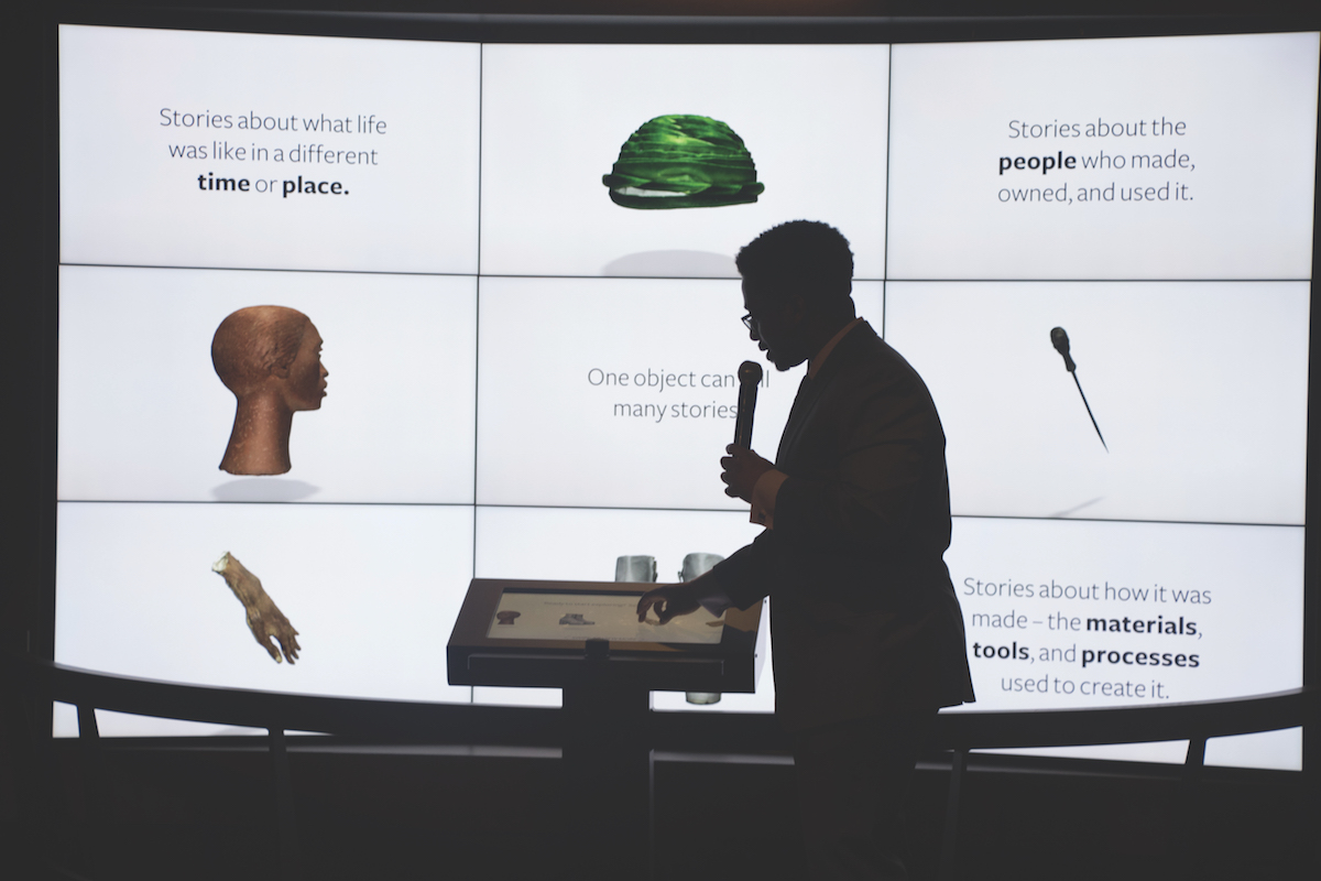 Google engineer Travis McPhail demonstrates an exhibit which allows visitors to interact with objects that have been scanned and made available in 3D representations at the National Museum of African American History and Culture. (Shevry Lassiter/The Washington Informer)