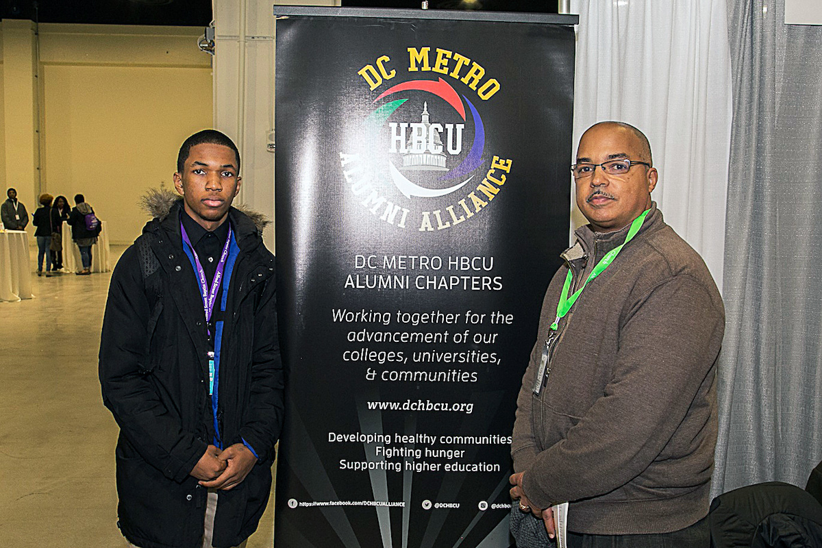 Jelani Jackson, a junior at Bishop McNamara High School in Forestville, Maryland, and his father, John Jackson, an engineer and Howard University graduate (Mark Mahoney/The Washington Informer)