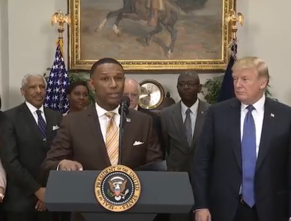Johnny Taylor Jr., former president of the Thurgood Marshall College Fund, speaks during a Feb. 27 event at the White House to announce his appointment by President Donald Trump (right) as chair of the president's board of advisers for historically Black colleges and universities (HBCUs).