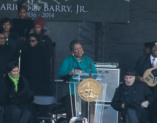 Cora Masters Barry speaks during the Marion Barry Jr. statue unveiling program held on Pennsylvania Avenue in front of the John Wilson District Building in Northwest on Saturday, March 3. (Shevry Lassiter/The Washington Informer)