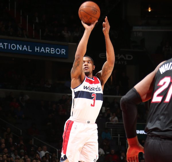 Washington Wizards guard Bradley Beal shoots a jumper over Miami Heat center Hassan Whiteside during the Wizards' 117-113 overtime win at Capital One Arena in D.C. on March 6. (Courtesy of the Wizards via Twitter)