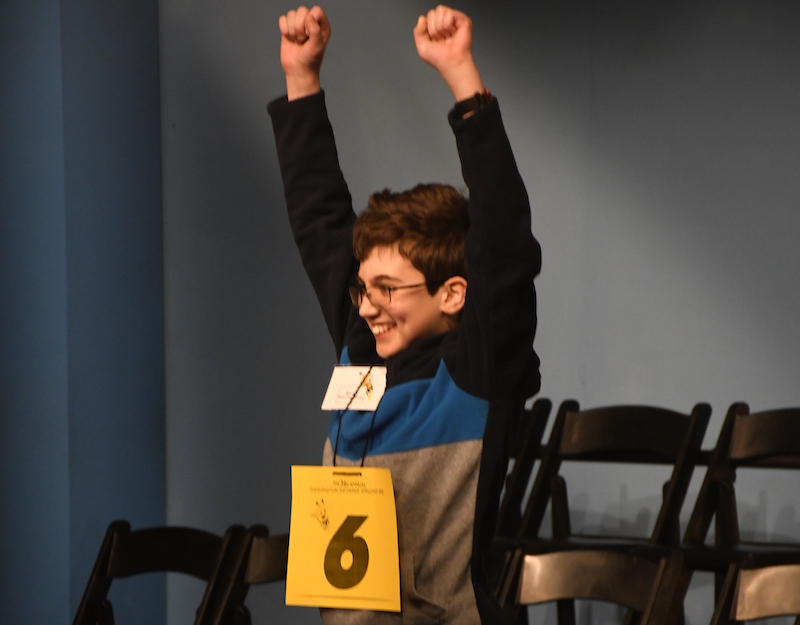 Simon Kirschenbaum, a seventh-grader at Deal Middle School in Northwest, celebrates after winning The Washington Informer's 36th Annual Spelling Bee. (Roy Lewis/The Washington Informer)