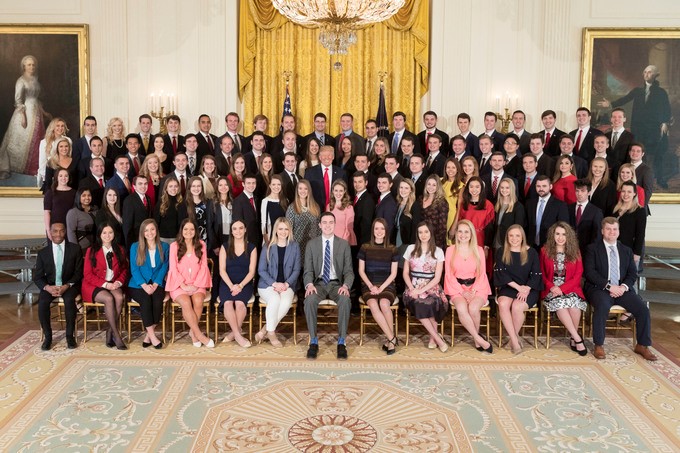 President Donald Trump (center) poses with the spring 2018 White House interns. (Courtesy of the White House)