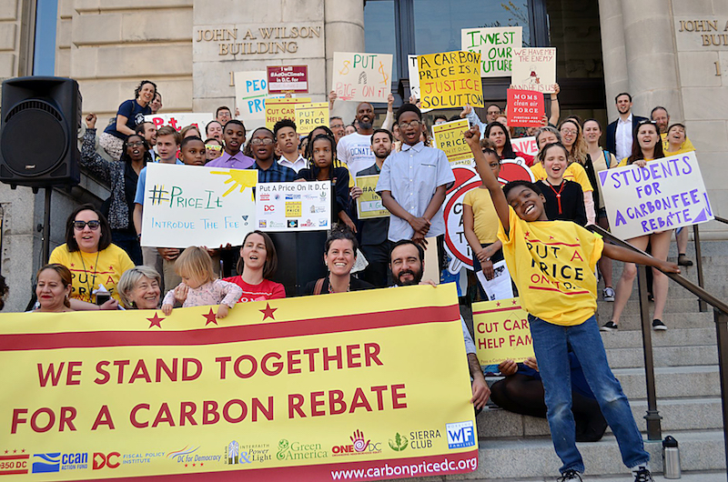 Student advocates of cutting carbon pollution rally at the John A. Wilson Building in northwest D.C. in favor of a carbon fee and rebate program. (Courtesy of Put a Price on It)